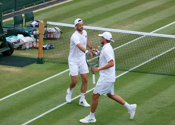 7th July 2025; All England Lawn Tennis and Croquet Club, London, England; Wimbledon Tennis Tournament, Day 8; Julian Cash (GBR) with partner Lloyd Glasspool (GBR) in their doubles match against Guido Andreozzi (ARG) and Marcelo Demoliner (BRA)  ActionPlus12811179 JohnxPatrickxFletcher