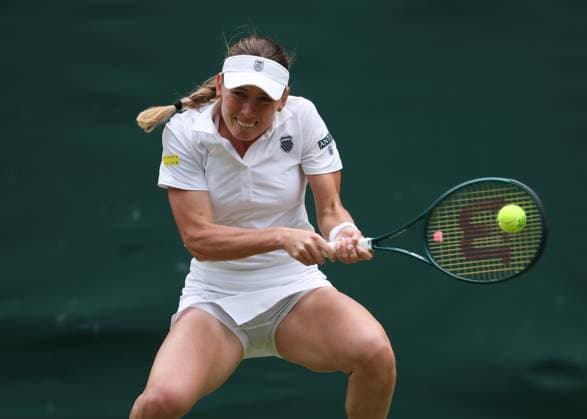 7th July 2025; All England Lawn Tennis and Croquet Club, London, England; Wimbledon Tennis Tournament, Day 8; Ekaterina Alexandrova (RUS) with a backhand shot to Belinda Bencic (SUI)  ActionPlus12811206 JohnxPatrickxFletcher