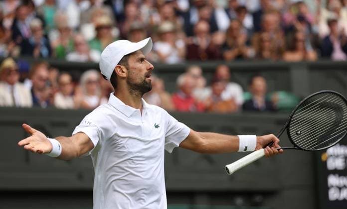 Serbian Novak Djokovic plays to the crowd in his fourth round match against Australia s Alex De Minaur on day eight of the 2025 Wimbledon Championships in London on Monday, July 07, 2025.  LON2025070704 HUGOxPHILPOTT