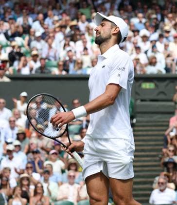 Serbian Novak Djokovic reacts in his fourth round match against Australia s Alex De Minaur on day eight of the 2025 Wimbledon Championships in London on Monday, July 07, 2025.  LON2025070707 HUGOxPHILPOTT