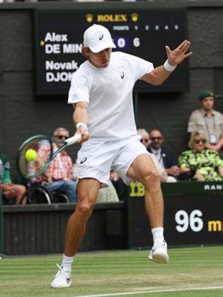 Australia s Alex De Minaur plays a forehand in his fourth round match against Serbian Novak Djokovic on day eight of the 2025 Wimbledon Championships in London on Monday, July 07, 2025.  LON2025070720 HUGOxPHILPOTT