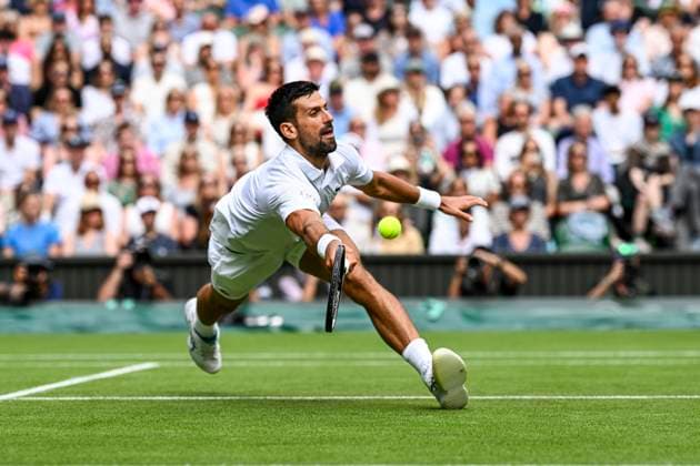 Novak Djokovic celebrates diving for forehand volley at the net during his Wimbledon 2025 Men?s Singles Round of 16 tennis match against Alex de Minaur at the All England Tennis Club in London, England (Richard Callis SPP) Copyright: xRichardxCallis SPPx spp-en-RiCa-SPP25_rica_07jul25_21454