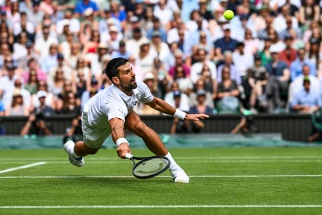 Novak Djokovic celebrates diving for forehand volley at the net during his Wimbledon 2025 Men?s Singles Round of 16 tennis match against Alex de Minaur at the All England Tennis Club in London, England (Richard Callis SPP) Copyright: xRichardxCallis SPPx spp-en-RiCa-SPP25_rica_07jul25_21456