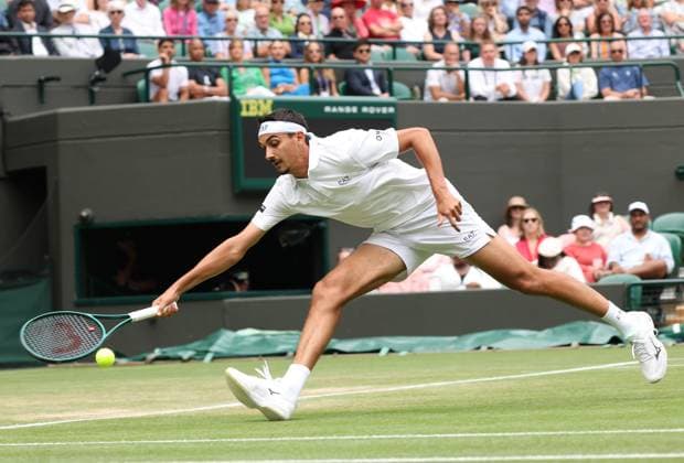 Italian Lorenzo Sonego plays a forehand in his fourth round match against American Ben Shelton on day eight of the 2025 Wimbledon Championships in London on Monday, July 07, 2025.  LON2025070748 HUGOxPHILPOTT