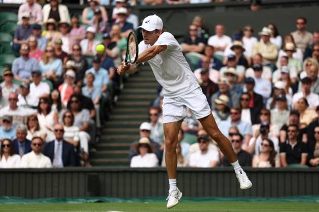 7th July 2025; All England Lawn Tennis and Croquet Club, London, England; Wimbledon Tennis Tournament, Day 8; Alex de Minaur (AUS) with a backhand shot to Novak Djokovic (SRB)  ActionPlus12811245 JohnxPatrickxFletcher