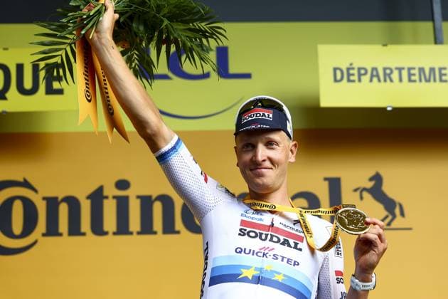 Belgian Tim Merlier of Soudal Quick-Step celebrates on the podium after winning the third stage of the 2025 Tour de France cycling, from Valenciennes to Dunkerque (178 km) on Monday 07 July 2025 in France. The 112th edition of the Tour de France starts on Saturday 5 July in Lille, France, and will finish in Paris, France on the 27th of July. DAVIDxPINTENS  x128612001x