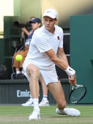 Italian Jannik Sinner plays a backhand in his fourth round match against Bulgarian Grigor Dimitrov on day eight of the 2025 Wimbledon Championships in London on Monday, July 07, 2025.  LON2025070792 HUGOxPHILPOTT