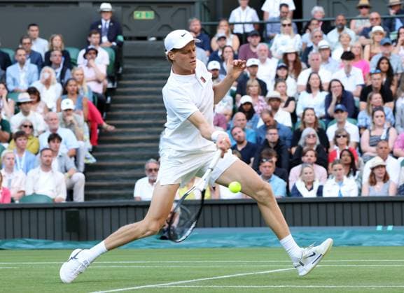 Italian Jannik Sinner plays a forehand in his fourth round match against Bulgarian Grigor Dimitrov on day eight of the 2025 Wimbledon Championships in London on Monday, July 07, 2025.  LON2025070795 HUGOxPHILPOTT