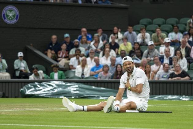 Grigor Dimitrov goes down injured when leading 2 sets to 0 during his Wimbledon 2025 Men?s Singles Round of 16 tennis match against Jannik Sinner at the All England Tennis Club in London, England Copyright: xx Sportspressphoto_SPR3875