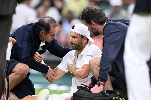 Grigor Dimitrov goes down injured when leading 2 sets to 0 during his Wimbledon 2025 Men?s Singles Round of 16 tennis match against Jannik Sinner at the All England Tennis Club in London, England Copyright: xx Sportspressphoto_SPR3896