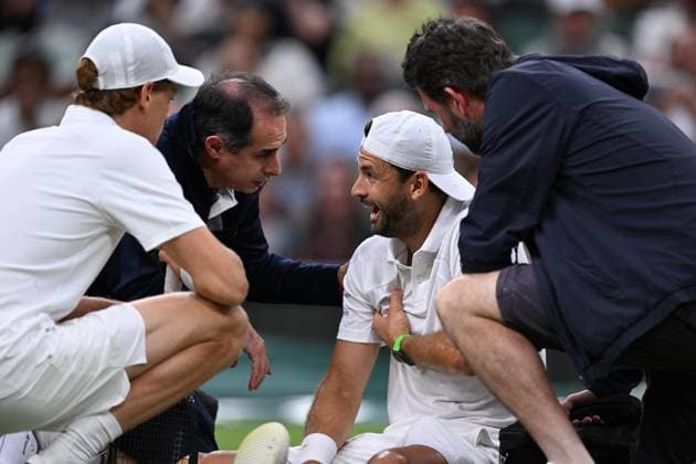Grigor Dimitrov goes down injured when leading 2 sets to 0 during his Wimbledon 2025 Men?s Singles Round of 16 tennis match against Jannik Sinner at the All England Tennis Club in London, England Copyright: xx Sportspressphoto_SPR3893