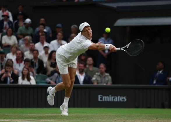 7th July 2025; All England Lawn Tennis and Croquet Club, London, England; Wimbledon Tennis Tournament, Day 8; Jannik Sinner (ITA) with a backhand shot to Grigor Dimitrov (BUL)  ActionPlus12811300 JohnxPatrickxFletcher