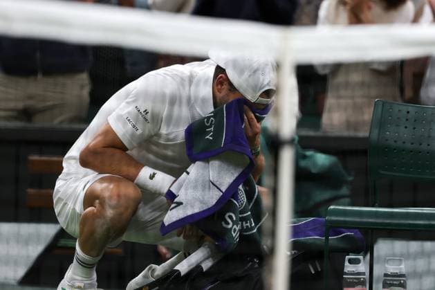 7th July 2025; All England Lawn Tennis and Croquet Club, London, England; Wimbledon Tennis Tournament, Day 8; A visibly upset Grigor Dimitrov (BUL) crying on his Wimbledon Towel after damaging his pectoral muscle from serving to Jannik Sinner (ITA)  ActionPlus12811294 JohnxPatrickxFletcher