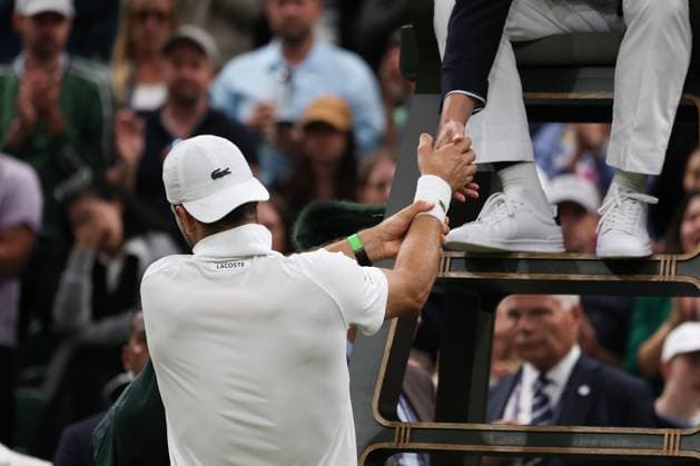 7th July 2025; All England Lawn Tennis and Croquet Club, London, England; Wimbledon Tennis Tournament, Day 8; Grigor Dimitrov (BUL) attempts to shake the hand of the umpire after damaging his pectoral muscle from serving to Jannik Sinner (ITA) to concede the match to Jannik Sinner (ITA)  ActionPlus12811296 JohnxPatrickxFletcher