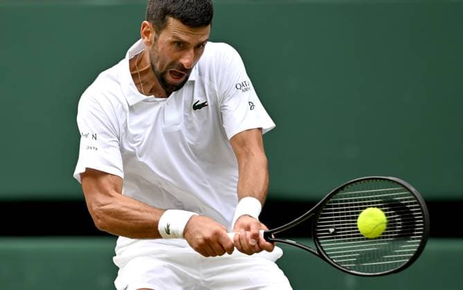 (250708) -- LONDON, July 8, 2025 -- Novak Djokovic hits a return during the men s singles round of 16 match between Novak Djokovic of Serbia and Alex De Minaur of Australia at the Wimbledon Tennis Championships in London, Britain, July 7, 2025. ) (SP)BRITAIN-LONDON-TENNIS-WIMBLEDON-MEN S SINGLES LixYing 