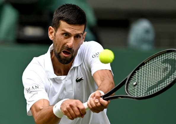 (250708) -- LONDON, July 8, 2025 -- Novak Djokovic hits a return during the men s singles round of 16 match between Novak Djokovic of Serbia and Alex De Minaur of Australia at the Wimbledon Tennis Championships in London, Britain, July 7, 2025. ) (SP)BRITAIN-LONDON-TENNIS-WIMBLEDON-MEN S SINGLES LixYing 