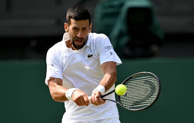 (250708) -- LONDON, July 8, 2025 -- Novak Djokovic hits a return during the men s singles round of 16 match between Novak Djokovic of Serbia and Alex De Minaur of Australia at the Wimbledon Tennis Championships in London, Britain, July 7, 2025. ) (SP)BRITAIN-LONDON-TENNIS-WIMBLEDON-MEN S SINGLES LixYing 
