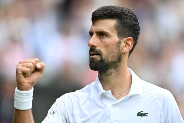 (250708) -- LONDON, July 8, 2025 -- Novak Djokovic reacts during the men s singles round of 16 match between Novak Djokovic of Serbia and Alex De Minaur of Australia at the Wimbledon Tennis Championships in London, Britain, July 7, 2025. ) (SP)BRITAIN-LONDON-TENNIS-WIMBLEDON-MEN S SINGLES LixYing 