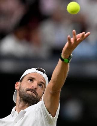 (250708) -- LONDON, July 8, 2025 -- Grigor Dimitrov serves during the men s singles round of 16 match between Grigor Dimitrov of Bulgaria and Jannik Sinner of Italy at the Wimbledon Tennis Championships in London, Britain, July 7, 2025. ) (SP)BRITAIN-LONDON-TENNIS-WIMBLEDON-MEN S SINGLES LixYing 