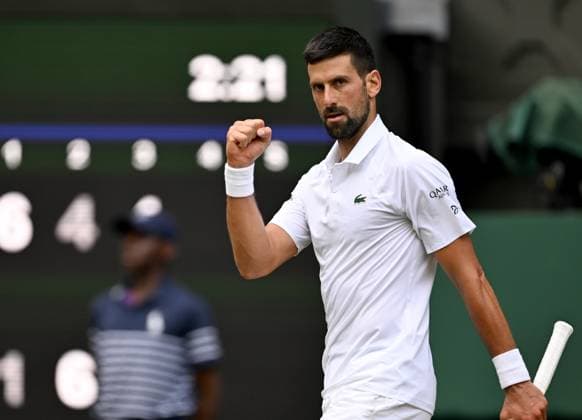 (250708) -- LONDON, July 8, 2025 -- Novak Djokovic reacts during the men s singles round of 16 match between Novak Djokovic of Serbia and Alex De Minaur of Australia at the Wimbledon Tennis Championships in London, Britain, July 7, 2025. ) (SP)BRITAIN-LONDON-TENNIS-WIMBLEDON-MEN S SINGLES LixYing 