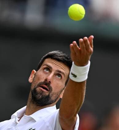 (250708) -- LONDON, July 8, 2025 -- Novak Djokovic serves during the men s singles round of 16 match between Novak Djokovic of Serbia and Alex De Minaur of Australia at the Wimbledon Tennis Championships in London, Britain, July 7, 2025. ) (SP)BRITAIN-LONDON-TENNIS-WIMBLEDON-MEN S SINGLES LixYing 