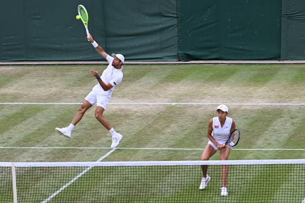 (250708) -- LONDON, July 8, 2025 -- Zhang Shuai (R) Marcelo Arevalo compete during the mixed doubles quarter final match between Zhang Shuai (China) Marcelo Arevalo (El Salvador) and Desirae Krawczyk (USA) Olivia Gadecki (Australia) at the Wimbledon Tennis Championships in London, Britain, July 7, 2025. ) (SP)BRITAIN-LONDON-TENNIS-WIMBLEDON-MIXED DOUBLES ZhaoxDingzhe 