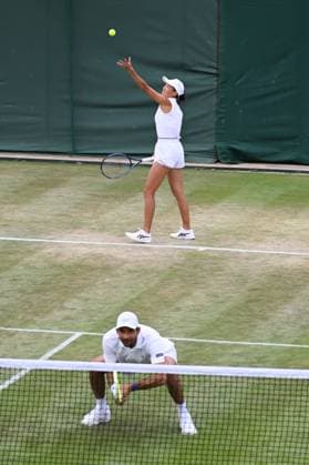 (250708) -- LONDON, July 8, 2025 -- Zhang Shuai (upper) Marcelo Arevalo compete during the mixed doubles quarter final match between Zhang Shuai (China) Marcelo Arevalo (El Salvador) and Desirae Krawczyk (USA) Olivia Gadecki (Australia) at the Wimbledon Tennis Championships in London, Britain, July 7, 2025. ) (SP)BRITAIN-LONDON-TENNIS-WIMBLEDON-MIXED DOUBLES ZhaoxDingzhe 