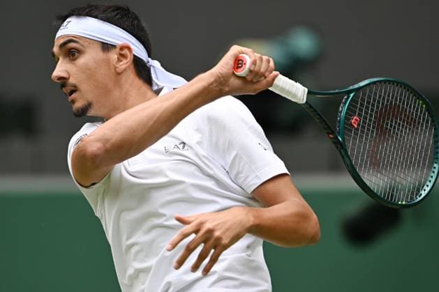 (250708) -- LONDON, July 8, 2025 -- Lorenzo Sonego hits a return during the men s singles round of 16 match between Ben Shelton of the United States and Lorenzo Sonego of Italy at the Wimbledon Tennis Championships in London, Britain, July 7, 2025 ) (SP)BRITAIN-LONDON-TENNIS-WIMBLEDON-MEN S SINGLES ZhaoxDingzhe 