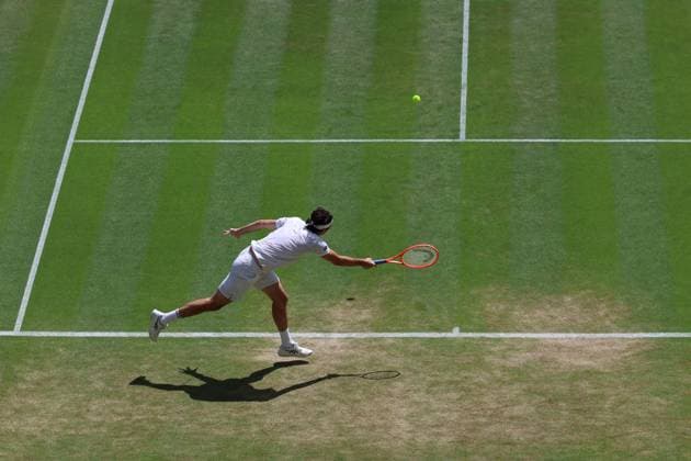 8th July 2025; All England Lawn Tennis and Croquet Club, London, England; Wimbledon Tennis Tournament, Day 9; Taylor Fritz (USA) with a forehand shot to Karen Khachanov (RUS) mens singles quarter-final match  ActionPlus12811374 JohnxPatrickxFletcher