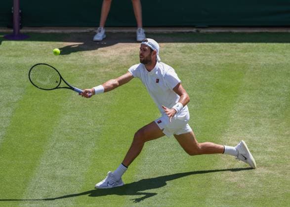 8th July 2025; All England Lawn Tennis and Croquet Club, London, England; Wimbledon Tennis Tournament, Day 9; Karen Khachanov (RUS) with a forehand shot to Taylor Fritz (USA) mens singles quarter-final match  ActionPlus12811382 JohnxPatrickxFletcher