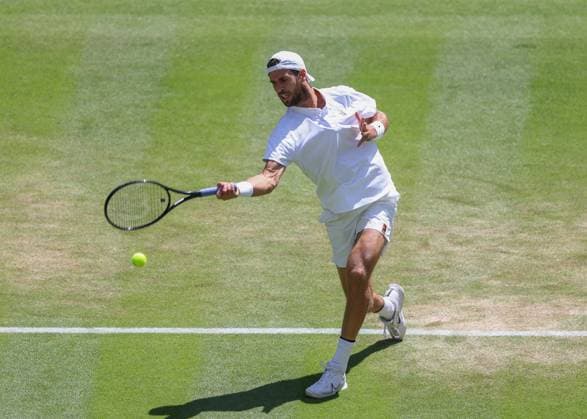 8th July 2025; All England Lawn Tennis and Croquet Club, London, England; Wimbledon Tennis Tournament, Day 9; Karen Khachanov (RUS) with a forehand shot to Taylor Fritz (USA) mens singles quarter-final match  ActionPlus12811383 JohnxPatrickxFletcher