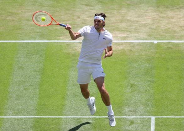 8th July 2025; All England Lawn Tennis and Croquet Club, London, England; Wimbledon Tennis Tournament, Day 9; Taylor Fritz (USA) with a forehand shot to Karen Khachanov (RUS) mens singles quarter-final match  ActionPlus12811386 JohnxPatrickxFletcher