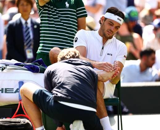 Taylor Fritz receives treatment between games during his quarter final match Wimbledon Tennis Championships, Day 9, The All England Lawn Tennis and Croquet Club, London, UK - 08 Jul 2025London The All England Lawn Tennis and United Kingdom  Copyright: xJamesxMarsh Shutterstockx 15389336bz