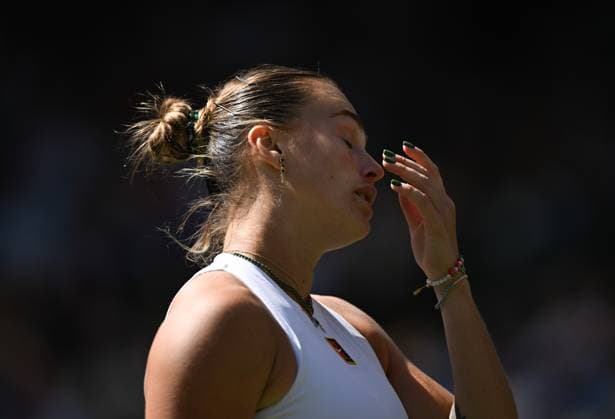 (250708) -- LONDON, July 8, 2025 -- Aryna Sabalenka reacts during the women s singles quarterfinal match between Aryna Sabalenka of Belarus and Laura Siegemund of Germany at the Wimbledon Tennis Championships in London, Britain, July 8, 2025. Li Ying) (SP)BRITAIN-LONDON-TENNIS-WIMBLEDON-WOMEN S SINGLES HanxYan 