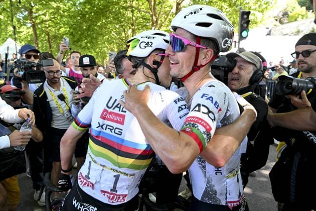 Portuguese Joao Almeida of UAE Team Emirates and Slovenian Tadej Pogacar of UAE Team Emirates celebrate after Pogacar won the fourth stage of the 2025 Tour de France cycling, Amien Metropole - Rouen (173 km), on Tuesday 08 July 2025 in France. The 112th edition of the Tour de France starts on Saturday 5 July in Lille, France, and will finish in Paris, France on the 27th of July. POOLxSZYMONxGRUCHALSKI  x128709645x