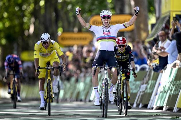 Slovenian Tadej Pogacar of UAE Team Emirates (C) celebrates as he wins before Dutch Mathieu van der Poel of Alpecin-Deceuninck (L) and Danish Jonas Vingegaard Hansen of Team Visma-Lease a Bike (R) the sprint at the finish of the fourth stage of the 2025 Tour de France cycling, Amien Metropole - Rouen (173 km), on Tuesday 08 July 2025 in France. The 112th edition of the Tour de France starts on Saturday 5 July in Lille, France, and will finish in Paris, France on the 27th of July. JASPERxJACOBS  x128710781x