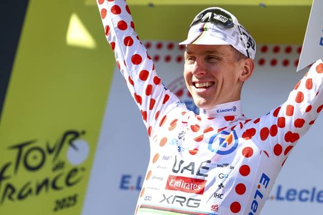 Slovenian Tadej Pogacar of UAE Team Emirates celebrates on the podium in the red polka-dot jersey for best climber after the fourth stage of the 2025 Tour de France cycling, Amien Metropole - Rouen (173 km), on Tuesday 08 July 2025 in France. The 112th edition of the Tour de France starts on Saturday 5 July in Lille, France, and will finish in Paris, France on the 27th of July. DAVIDxPINTENS  x128711029x