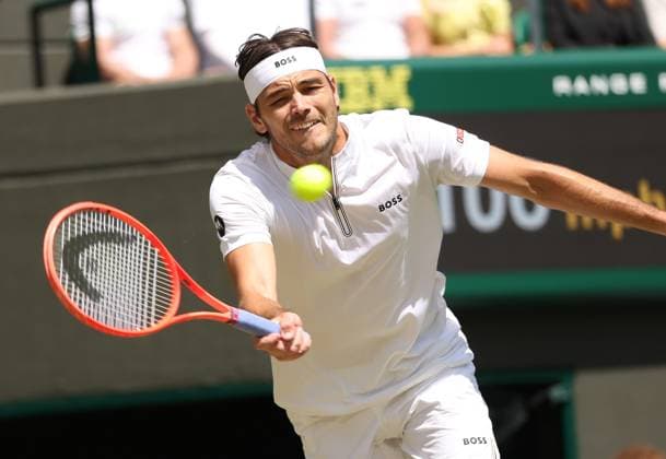 American Taylor Fritz plays a forehand in his Quarter-Final match against Karen Khachanov on day nine of the 2025 Wimbledon Championships in London on Tuesday, July 08, 2025.  LON2025070802 HUGOxPHILPOTT