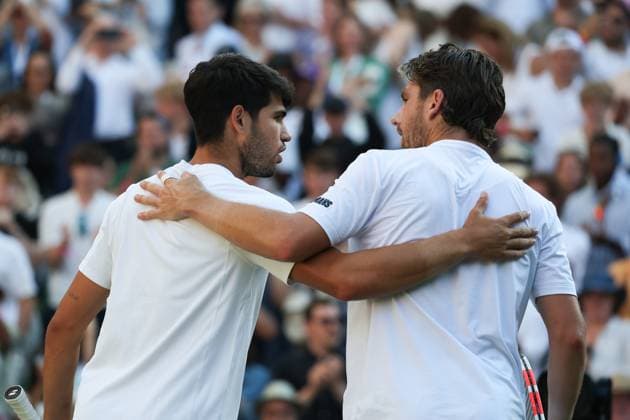 8th July 2025; All England Lawn Tennis and Croquet Club, London, England; Wimbledon Tennis Tournament, Day 9; Defending Champion Carlos Alcaraz (ESP) embraces Cameron Norrie (GBR) defeating the British Number One in straight sets to book his place in the Gentlemen& x2019;s singles Semi Final  ActionPlus12811423 JohnxPatrickxFletcher