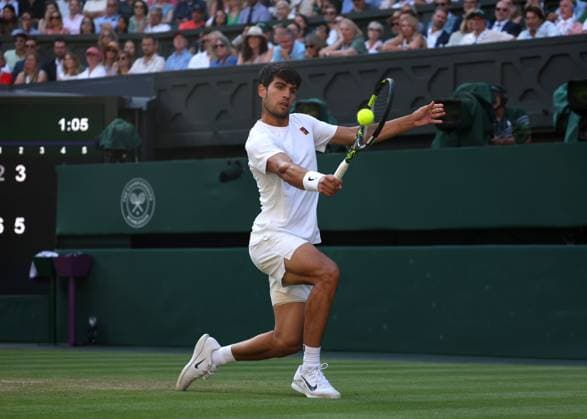 8th July 2025; All England Lawn Tennis and Croquet Club, London, England; Wimbledon Tennis Tournament, Day 9; Carlos Alcaraz (ESP) with a backhand shot to Cameron Norrie (GBR)  ActionPlus12811438 JohnxPatrickxFletcher