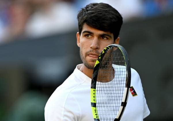 (250709) -- LONDON, July 9, 2025 -- Carlos Alcaraz reacts during the men s singles quarterfinal match between Carlos Alcaraz of Spain and Cameron Norrie of Britain at the Wimbledon Tennis Championships in London, Britain, July 8, 2025. ) (SP)BRITAIN-LONDON-TENNIS-WIMBLEDON-MEN S SINGLES LixYing 