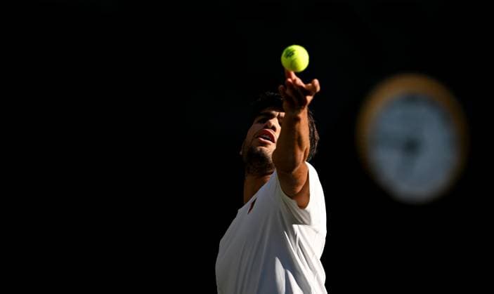 (250709) -- LONDON, July 9, 2025 -- Carlos Alcaraz serves during the men s singles quarterfinal match between Carlos Alcaraz of Spain and Cameron Norrie of Britain at the Wimbledon Tennis Championships in London, Britain, July 8, 2025. ) (SP)BRITAIN-LONDON-TENNIS-WIMBLEDON-MEN S SINGLES LixYing 