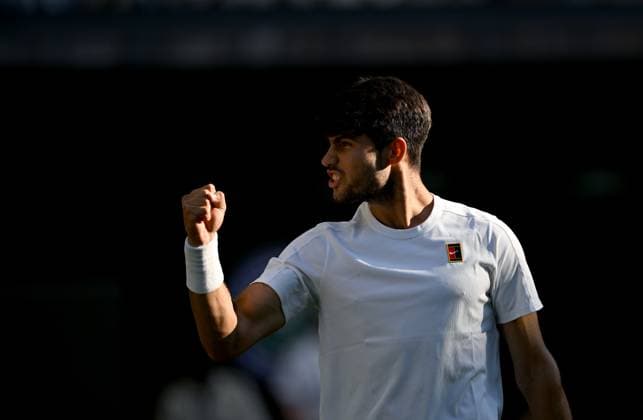 (250709) -- LONDON, July 9, 2025 -- Carlos Alcaraz celebrates after the men s singles quarterfinal match between Carlos Alcaraz of Spain and Cameron Norrie of Britain at the Wimbledon Tennis Championships in London, Britain, July 8, 2025. ) (SP)BRITAIN-LONDON-TENNIS-WIMBLEDON-MEN S SINGLES LixYing 