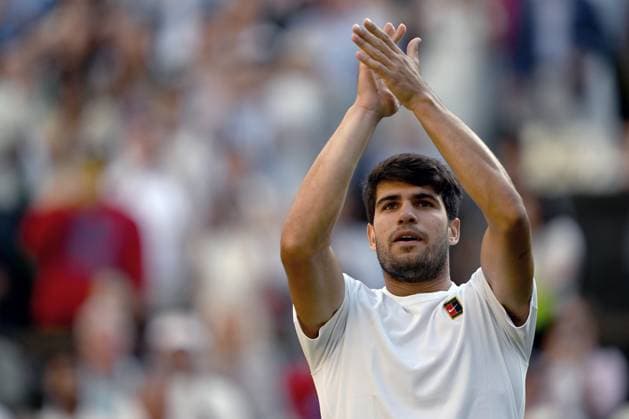 (250709) -- LONDON, July 9, 2025 -- Carlos Alcaraz celebrates after the men s singles quarterfinal match between Carlos Alcaraz of Spain and Cameron Norrie of Britain at the Wimbledon Tennis Championships in London, Britain, July 8, 2025. ) (SP)BRITAIN-LONDON-TENNIS-WIMBLEDON-MEN S SINGLES LixYing 