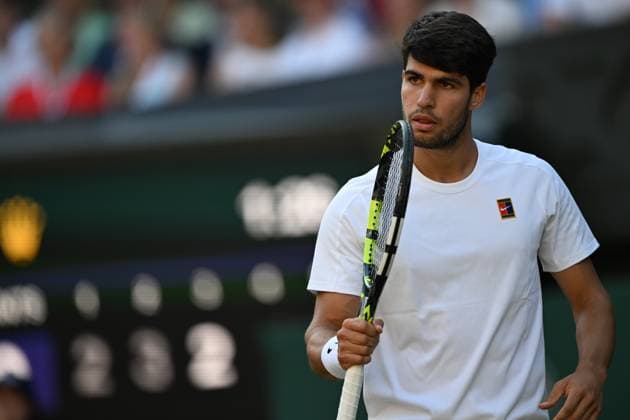 (250709) -- LONDON, July 9, 2025 -- Carlos Alcaraz reacts during the men s singles quarterfinal match between Carlos Alcaraz of Spain and Cameron Norrie of Britain at the Wimbledon Tennis Championships in London, Britain, July 8, 2025. ) (SP)BRITAIN-LONDON-TENNIS-WIMBLEDON-MEN S SINGLES LixYing 