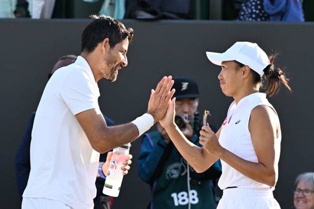 (250709) -- BEIJING, July 9, 2025 -- Zhang Shuai (R) celebrates with Marcelo Arevalo after the mixed doubles quarter final match between Zhang Shuai (China) Marcelo Arevalo (El Salvador) and Desirae Krawczyk (USA) Olivia Gadecki (Australia) at the Wimbledon Tennis Championships in London, Britain, July 7, 2025. ) XINHUA PHOTOS OF THE DAY ZhaoxDingzhe 