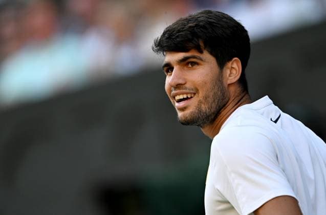 (250709) -- LONDON, July 9, 2025 -- Carlos Alcaraz reacts during the men s singles quarterfinal match between Carlos Alcaraz of Spain and Cameron Norrie of Britain at the Wimbledon Tennis Championships in London, Britain, July 8, 2025. ) (SP)BRITAIN-LONDON-TENNIS-WIMBLEDON-MEN S SINGLES LixYing 