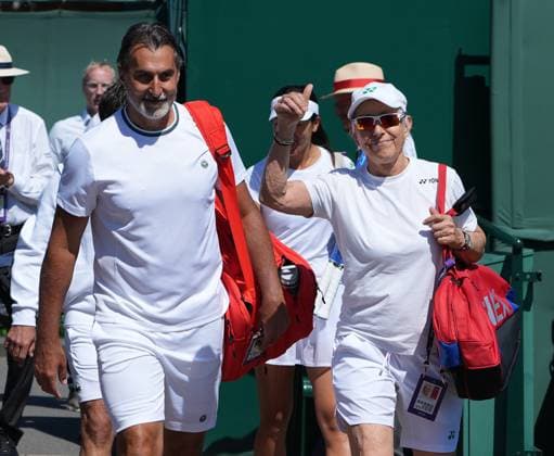 Tennis - 2025 Wimbledon Championships - Mixed Invitation Doubles - Nenad Zimonjic (SRB) and Martina Navratilova v Fabrice Santoro (France) and Anne Keothavong (GBR) All England Lawn Tennis & Croquet Club - Wednesday 9th July 2025 Martina Navratilova - USA gives the thumbs up as she arrives on court with partner, Nenad Zimonjic 