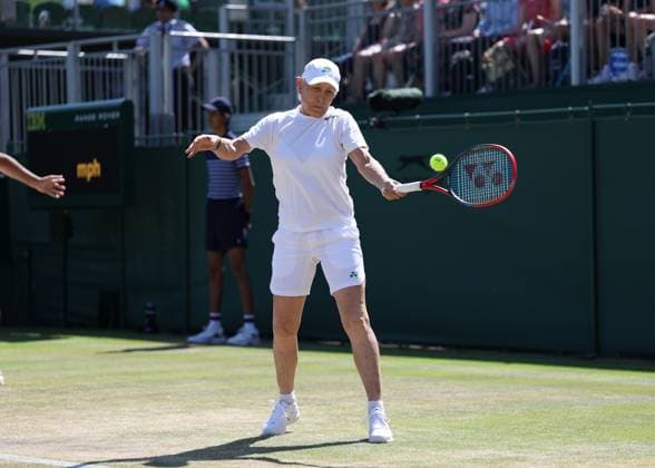 9th July 2025; All England Lawn Tennis and Croquet Club, London, England; Wimbledon Tennis Tournament, Day 10; Martina Navratilova (USA) with a forehand shot to Anne Keothavong (GBR) in her mixed doubles match  ActionPlus12811561 JohnxPatrickxFletcher