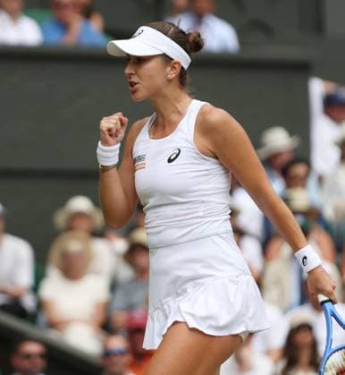 Switzerland s Belinda Bencic plays a forehand in her Quarter-Final match against Mirra Andreeva on day ten of the 2025 Wimbledon Championships in London on Wednesday, July 09, 2025.  LON2025070939 HUGOxPHILPOTT